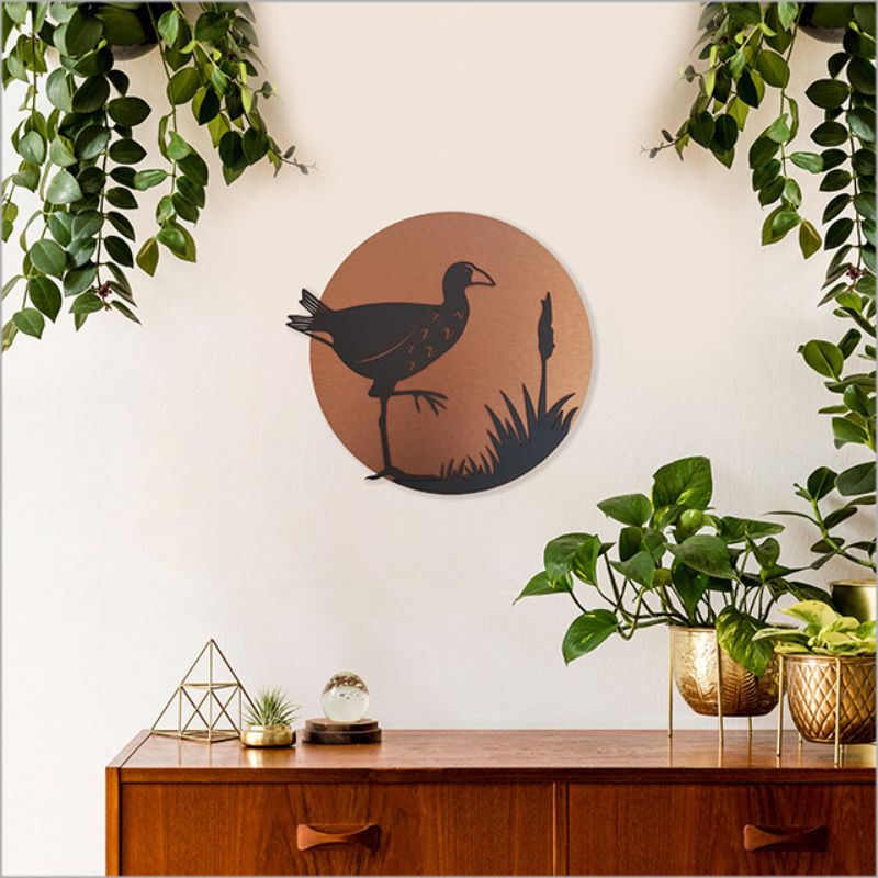 Brushed copper circle wall art featuring a Pukeko design, perfect for indoor and outdoor decor, ready to hang.