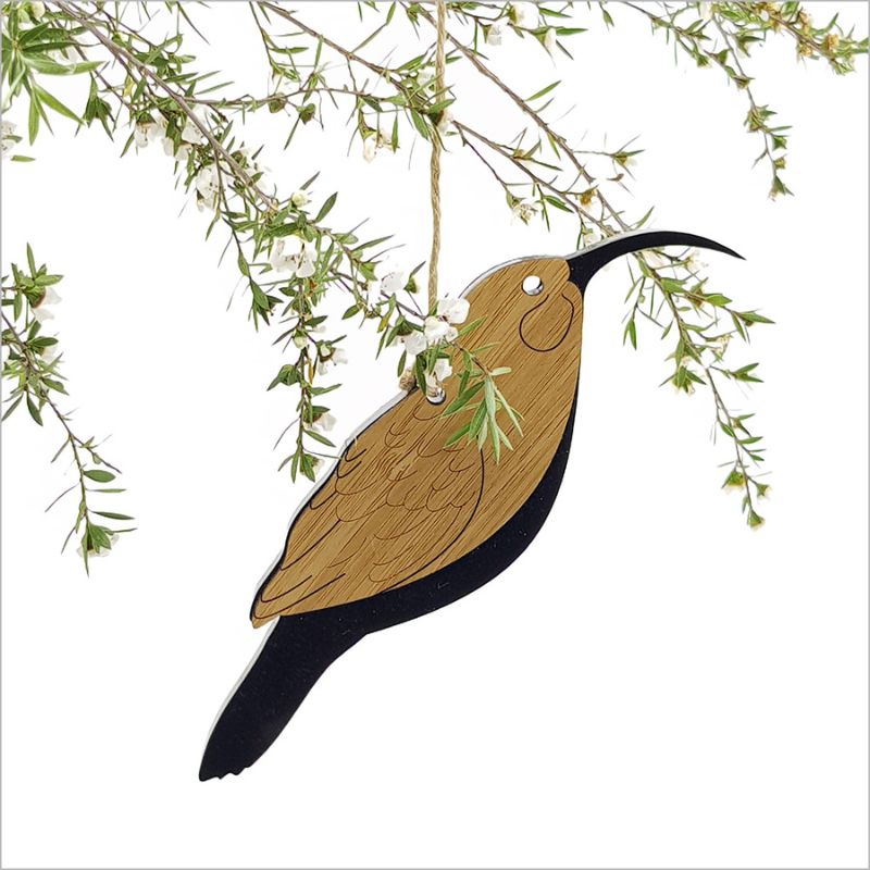 Elegant Huia hanging ornament made of bamboo and satin black acrylic, measuring 165mm x 98mm, ready to hang for festive decor.