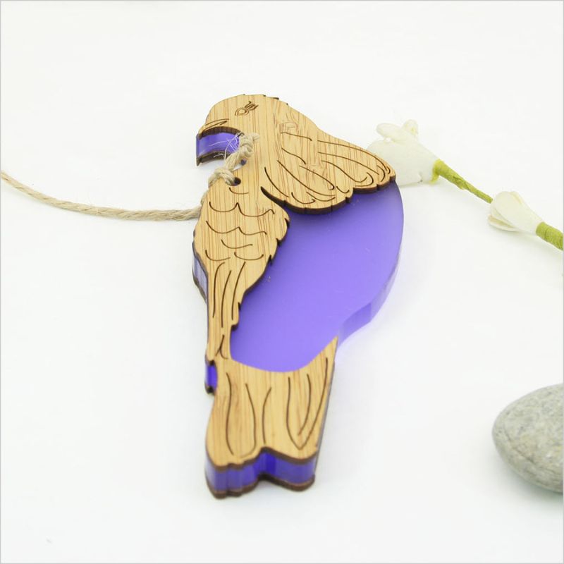 Hanging bamboo ornament featuring a Kereru bird design, vibrant purple satin acrylic, eco-friendly, and perfect for home decor.