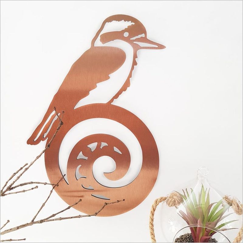 Brushed copper wall art featuring a kingfisher on a koru, symbolizing new beginnings, perfect for indoor or outdoor decor.