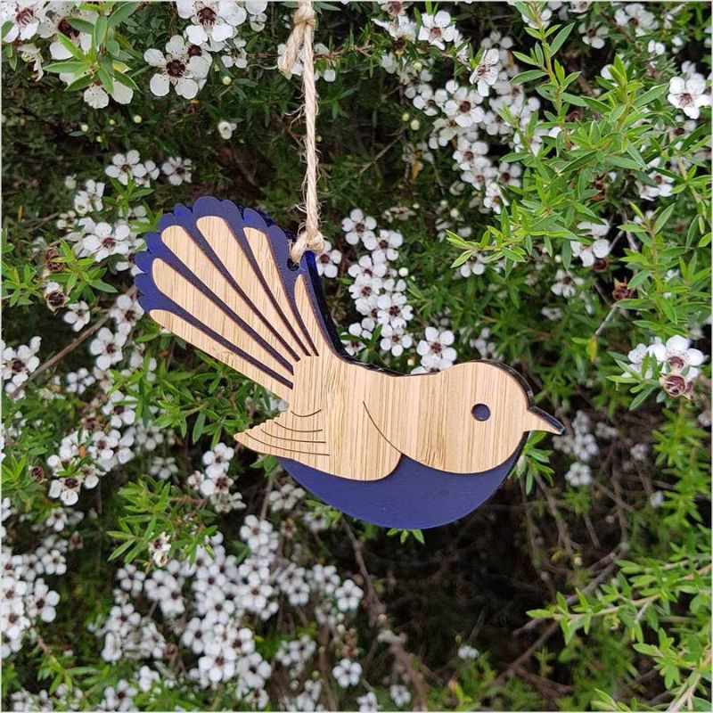 Hanging ornament featuring a blue satin fantail design on laser-cut bamboo, perfect for eco-friendly décor.