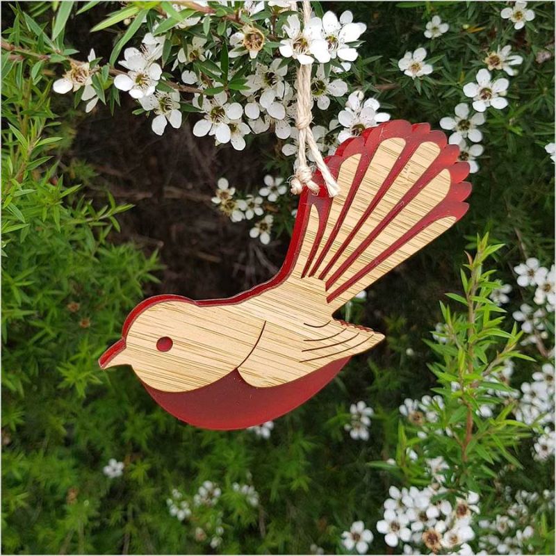 Elegant red satin-acrylic and laser-cut bamboo fantail ornament, perfect for festive decor or thoughtful gifting.
