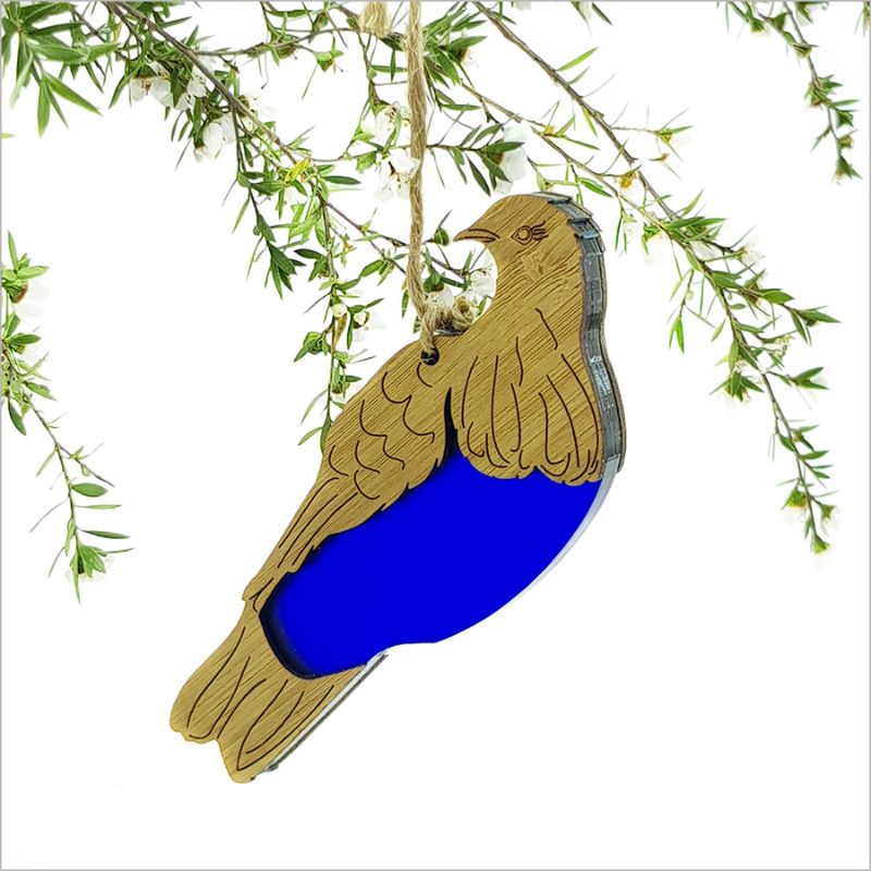 Hanging ornament featuring a Kereru design, crafted from bamboo and vibrant blue satin acrylic, ideal for home decor.