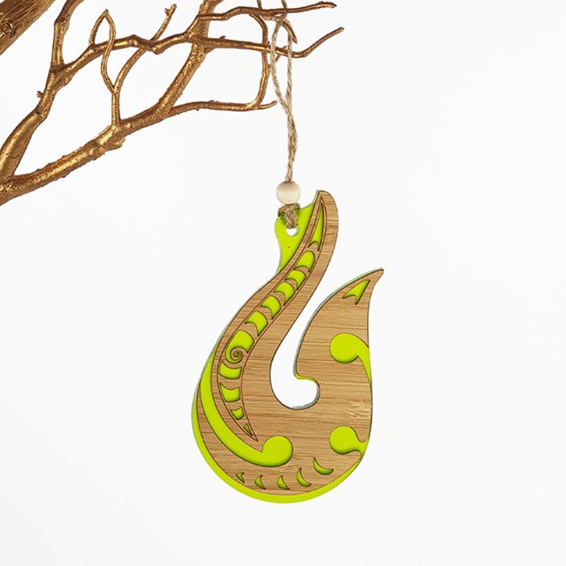 Vibrant lime green satin acrylic ornament with laser-cut bamboo, perfect for hanging decor and brightening any space.