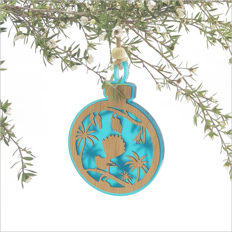 Teal acrylic bauble featuring a laser-cut fantail on a kowhai branch, perfect for home decor and gifts.