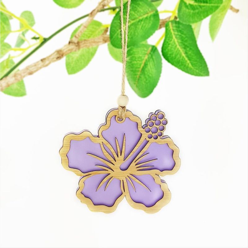 Purple satin acrylic hibiscus ornament with intricate laser cut details, perfect for home decor and gifting.