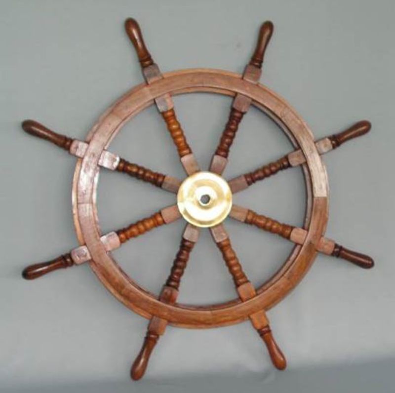 Nautical 93cm wood ship's wheel with a brass center, perfect for coastal and vintage decor.