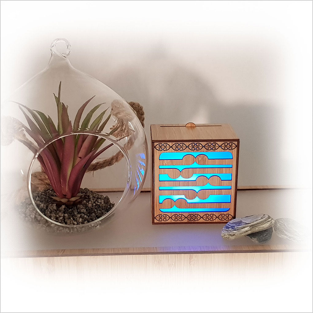 Koru LED Tealight Candle Box in laser-cut bamboo, featuring color-changing tealight; perfect for decor or wall display.