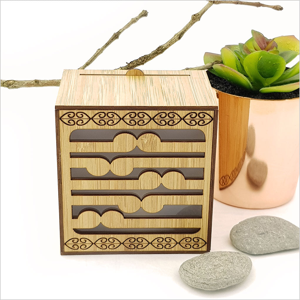Koru LED tealight candle box in bamboo, featuring a color-changing candle for a serene ambiance and wall-mount option.