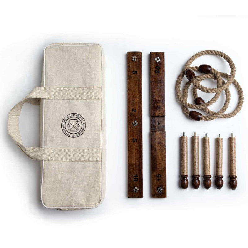 Vintage-inspired Backyard Quoits Set with wooden boards, stakes, and rope rings for outdoor fun, packed in a stylish canvas bag.