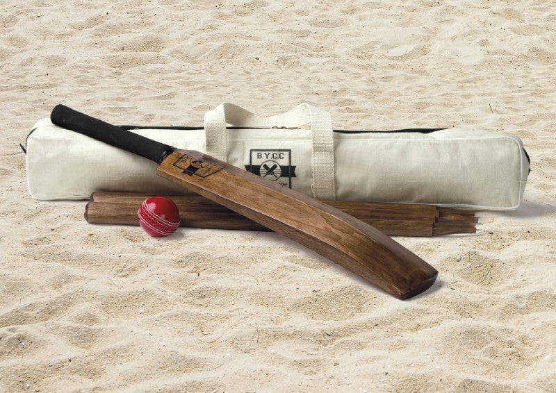 Vintage-inspired backyard cricket set with wooden bat, wickets, ball, and carry bag for outdoor fun.