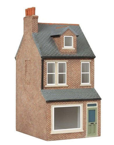 Hornby Parkers Newsagents model features vibrant signage and charming facade, perfect for enriching railway dioramas.