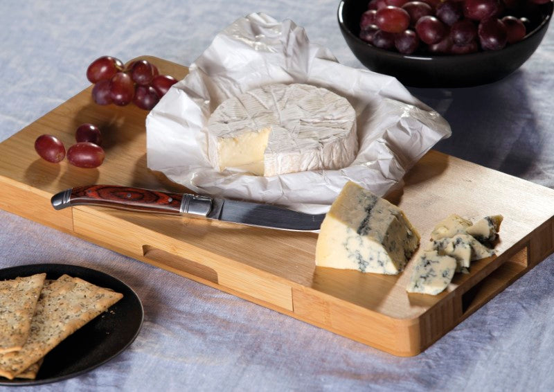 Gourmet cheese board set crafted from bamboo, featuring stainless steel utensils, and a retractable drawer for hosting gatherings.