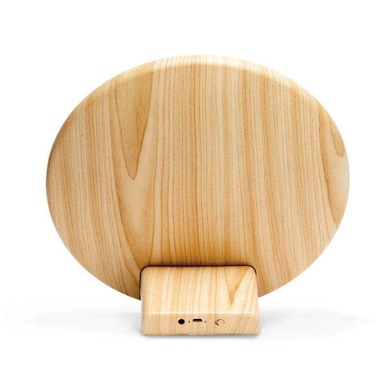 Stylish Lounge Disc Bluetooth Speaker with fabric face, wood grain housing, 10W output, 4.5 hours playtime, and USB charging.