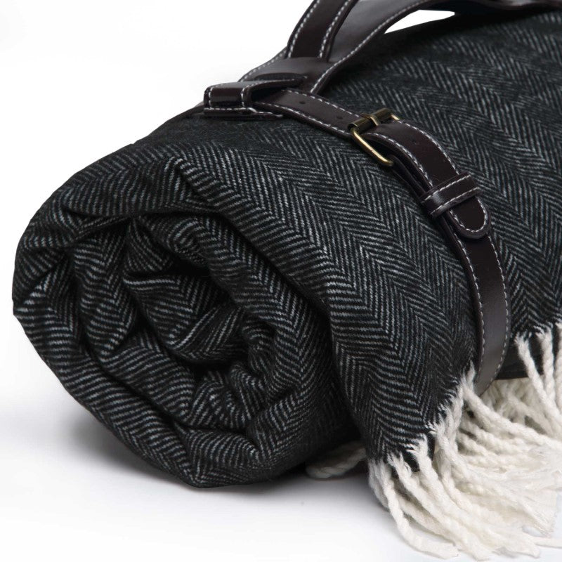 Ombrello Picnic Blanket with herringbone weave, waterproof backing, and umbrella hole; stylish carry handles for outdoor comfort.