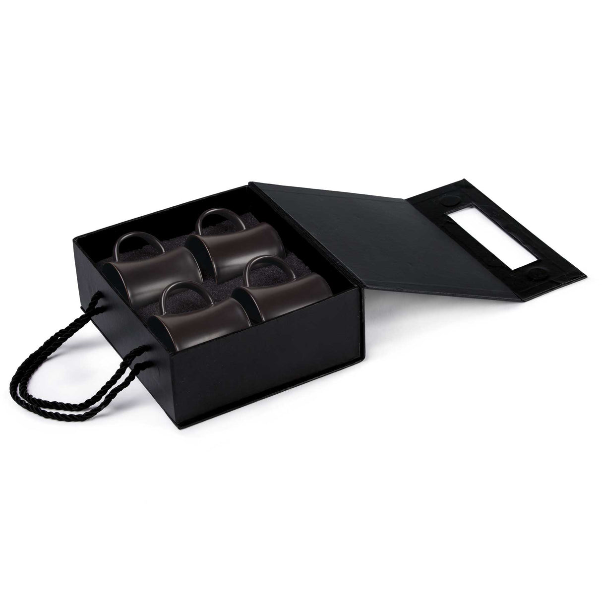 Elegant Quartetto Espresso Set featuring four matte black ceramic cups designed for exquisite coffee moments.