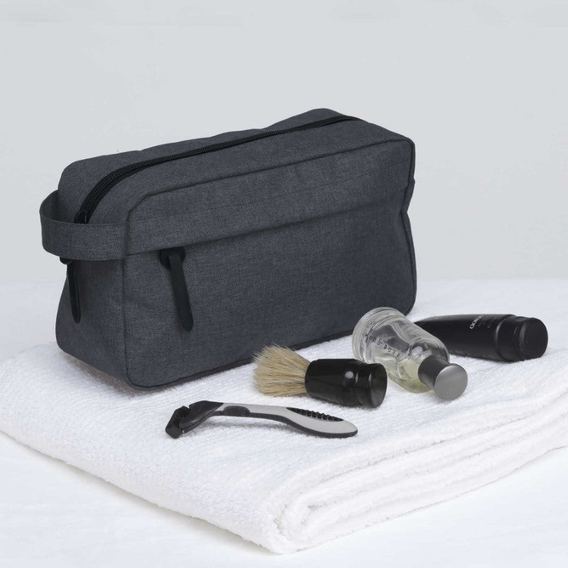 Stylish smpli Wetpac Wash Kit in black and white, featuring spacious compartments and a durable design for travel grooming essentials.