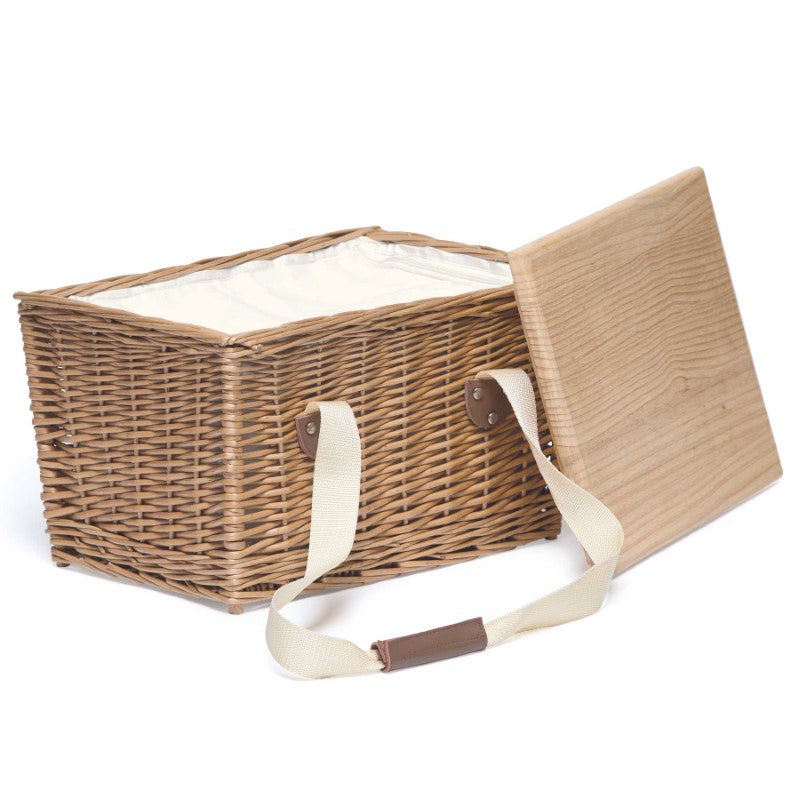 Handcrafted wicker picnic basket with insulated cooler, removable serving board lid, and leather-wrapped handles.