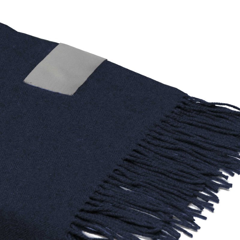 Mt Lodge Merino Blanket Throw featuring soft 100% Merino wool, elegant herringbone weave, and stylish fringes for cozy decor.