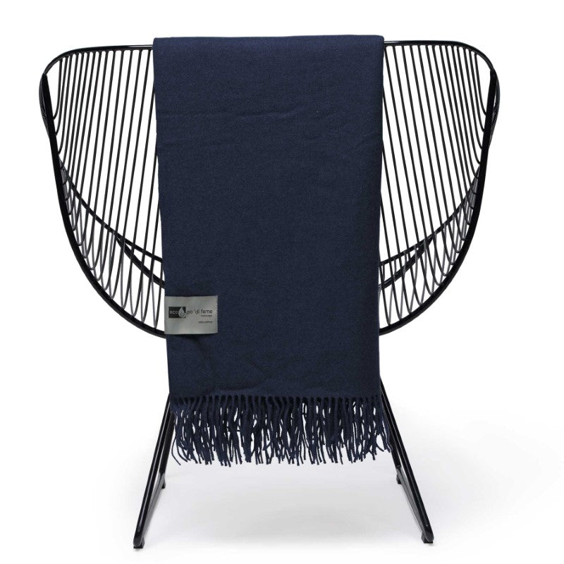 Soft 100% Merino wool blanket throw with herringbone weave, fringes, and luxurious feel, ideal for cozy living spaces.