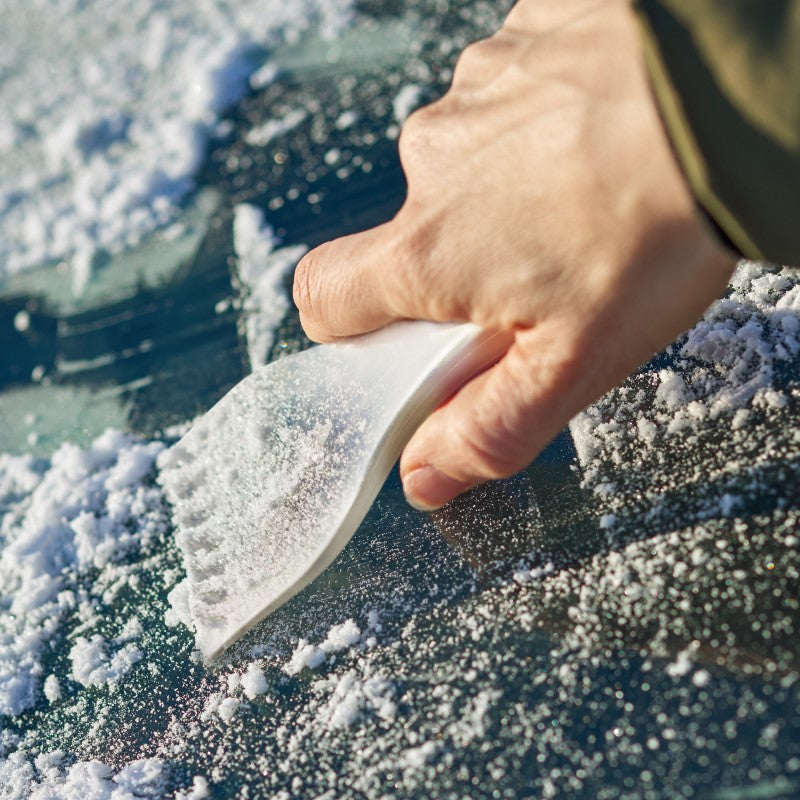 Set of 20 frosted clear ice scrapers made of durable polystyrene, featuring a serrated edge for effective ice removal.