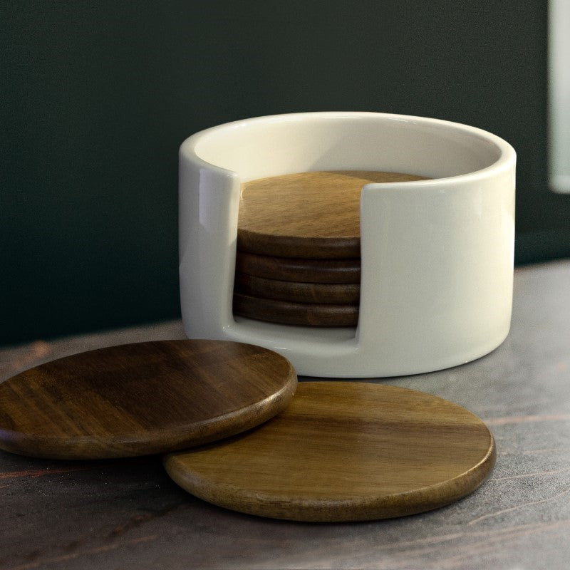 Set of six natural Acacia wood coasters in a black keepsake box, featuring unique grain patterns and a ceramic holder for storage.