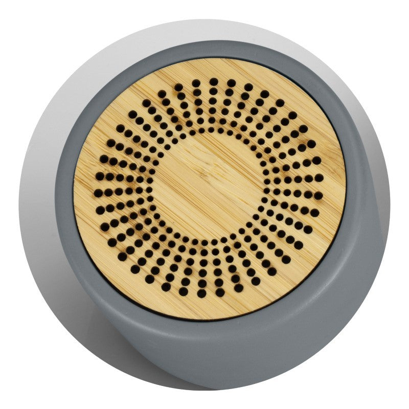 Stylish charcoal Bluetooth mini speaker with limestone casing, bamboo grill, 3W sound, and 3-hour playtime.