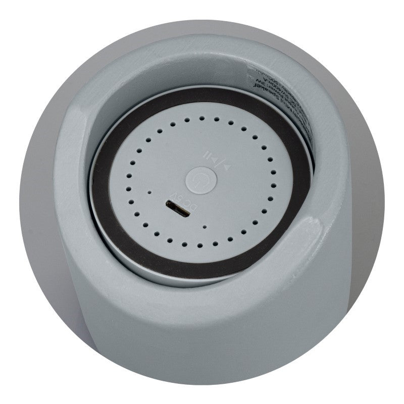 Stylish NATURA Bluetooth Mini Speaker in Charcoal with unique limestone casing and bamboo grill, delivering 3W sound.