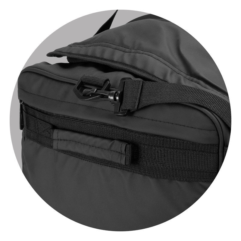 Aquinas 50L black duffle bag, water-resistant with multiple pockets, sturdy handles, and adjustable shoulder strap for travelers.
