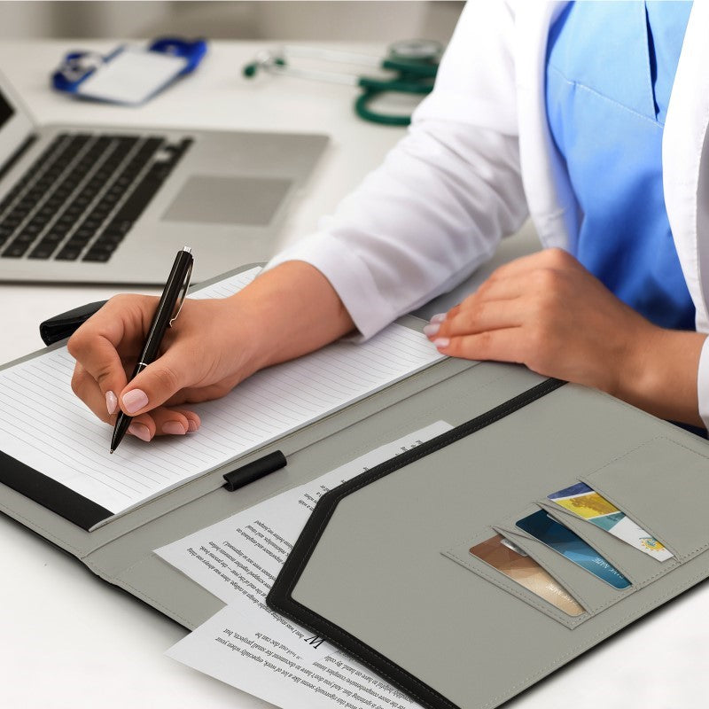 Sleek black PU leather A4 portfolio with magnetic closure, notepad, card holders, and pen loop for professional organization.