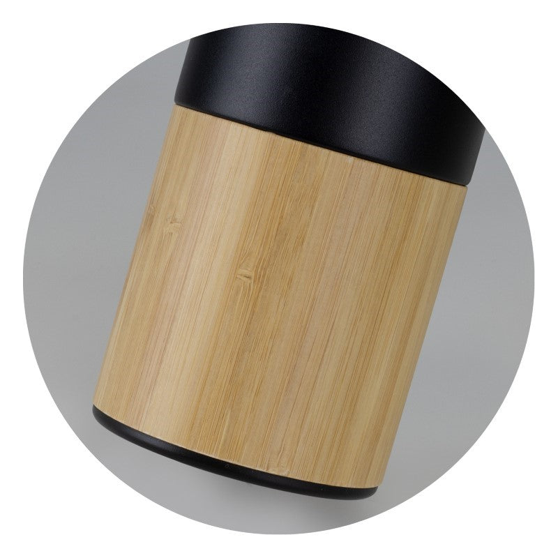 Mica 560ml Vacuum Bottle in Black/Natural, featuring insulated stainless steel, detachable tea infuser, and bamboo trim for stylish hydration.