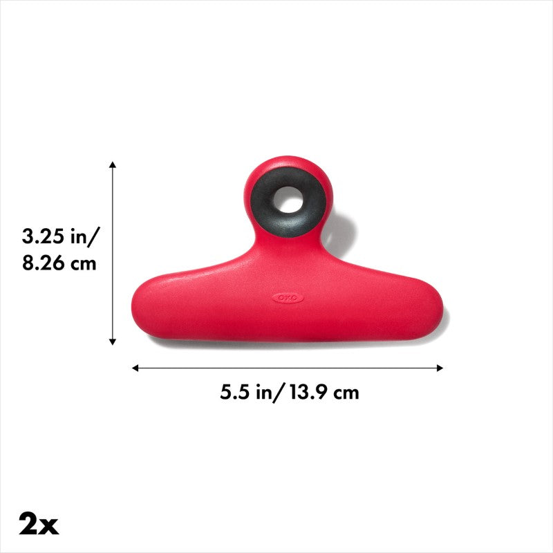 Two OXO Good Grips bag clips in sturdy plastic, featuring non-slip grips, perfect for sealing food bags and hands-free reading.