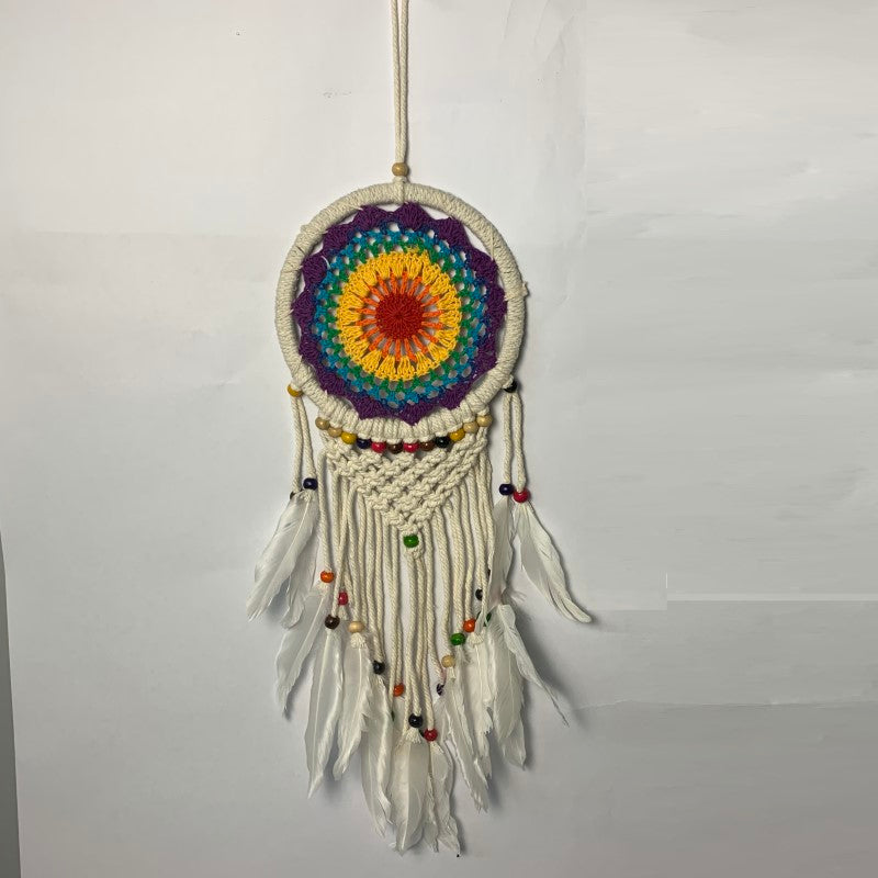 Vibrant 17cm crochet dreamcatcher, beautifully handmade for boho decor and protection against bad dreams.