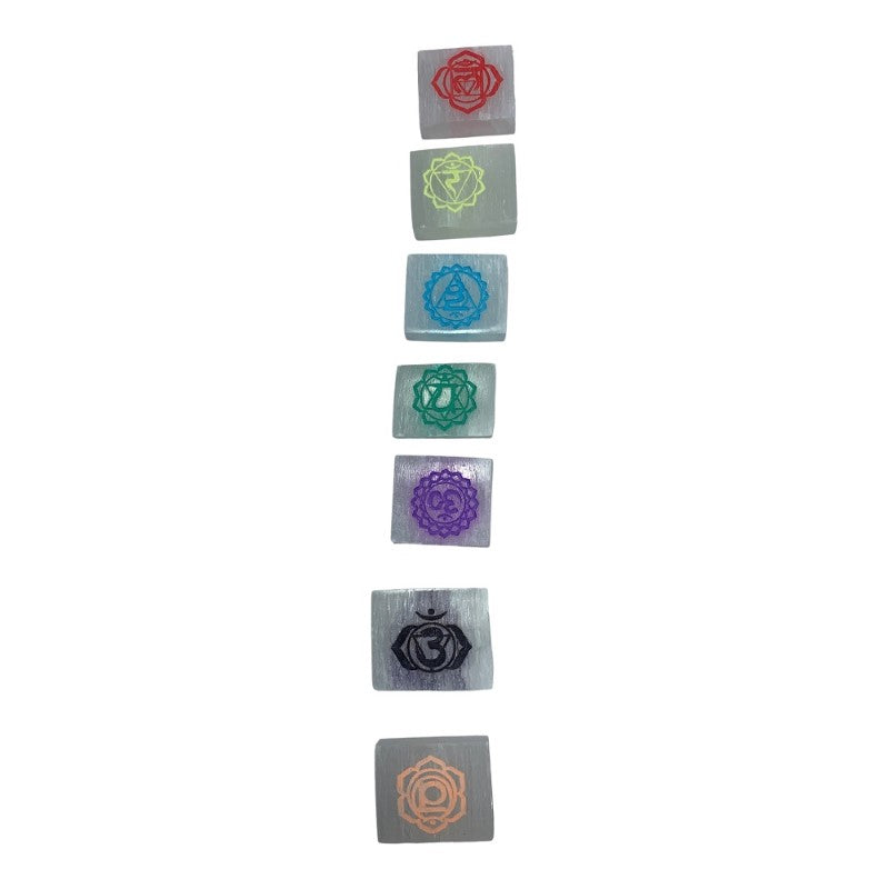 Hand-carved 7 Chakra Charging Plaques made of pure selenite, ideal for cleansing and recharging crystals.