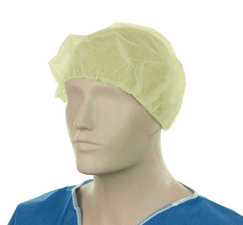 Yellow polypropylene bouffant hats, 610mm wide, designed for larger hairstyles; 600 disposable caps for hygiene in professional settings.