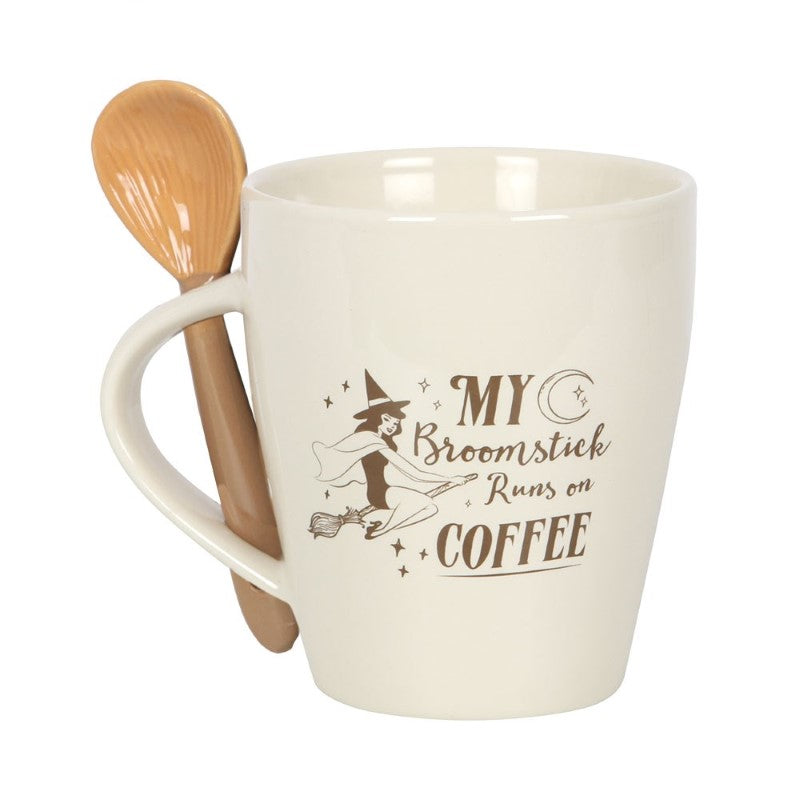 Enchanting coffee mug set featuring a flying witch design and slotted handle for the matching broom spoon.