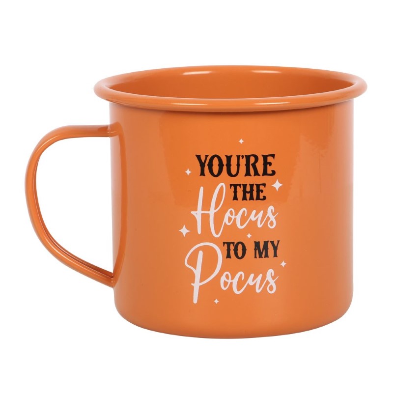 Whimsical orange enamel mug with 'You're The Hocus To My Pocus' text, perfect for cozy autumn beverages and Halloween vibes.