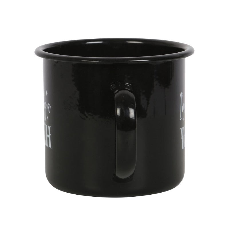 Black enamel mug with whimsical "I'm Secretly A Witch" text, perfect for Halloween and enjoying cozy beverages.