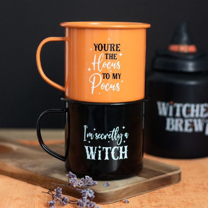 Set of 2 Wicked Witch Enamel Mugs featuring whimsical sayings for magical sipping and Halloween celebrations.