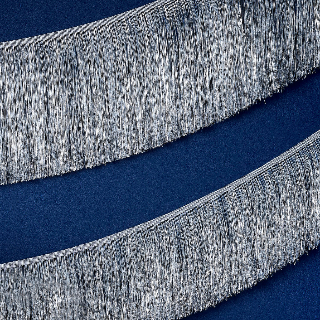 Silver tinsel garland measuring 20cm x 2m, perfect for adding festive glamour to holiday celebrations and eco-friendly.