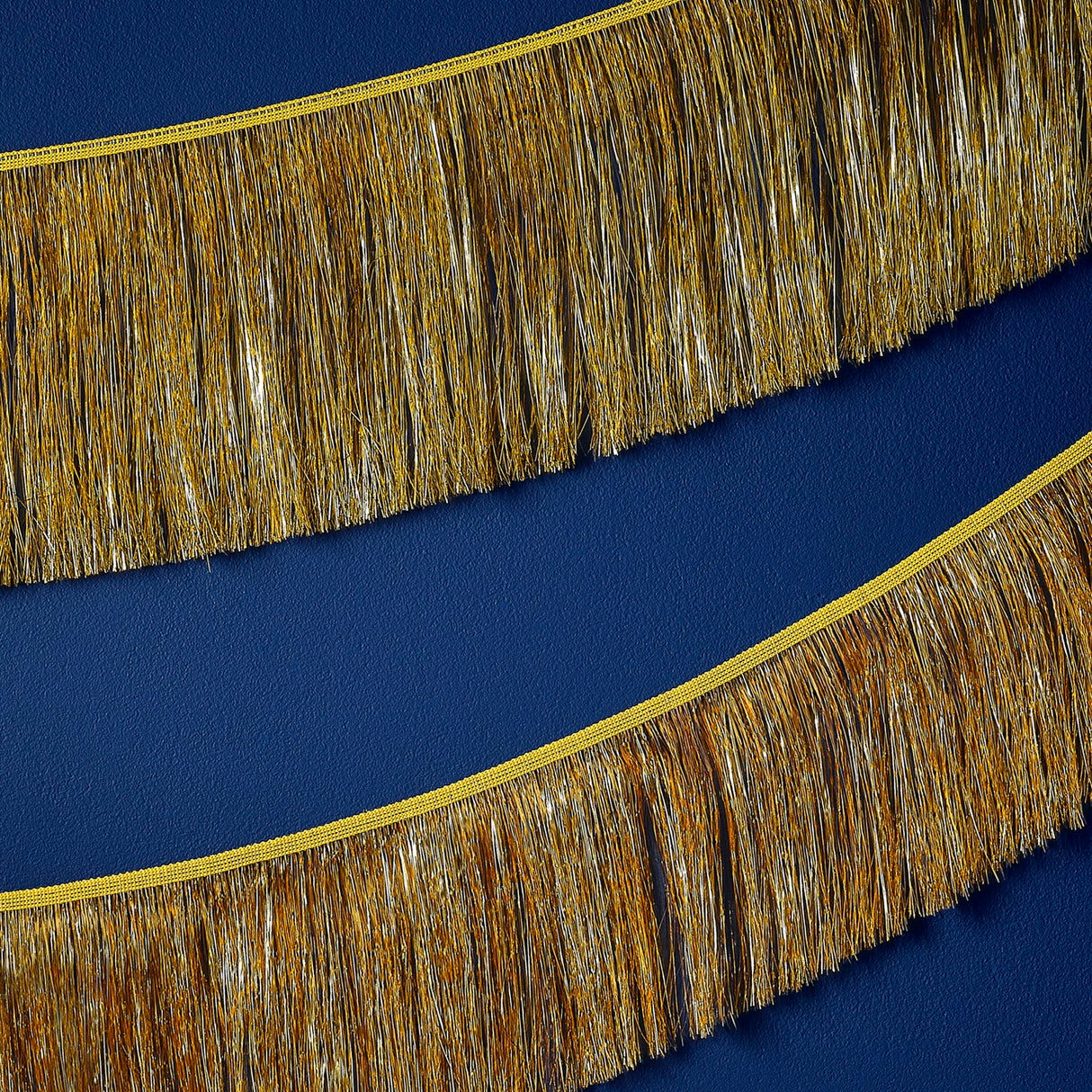 Gold tinsel garland measuring 20cm x 2m, perfect for festive decor and eco-friendly celebrations.