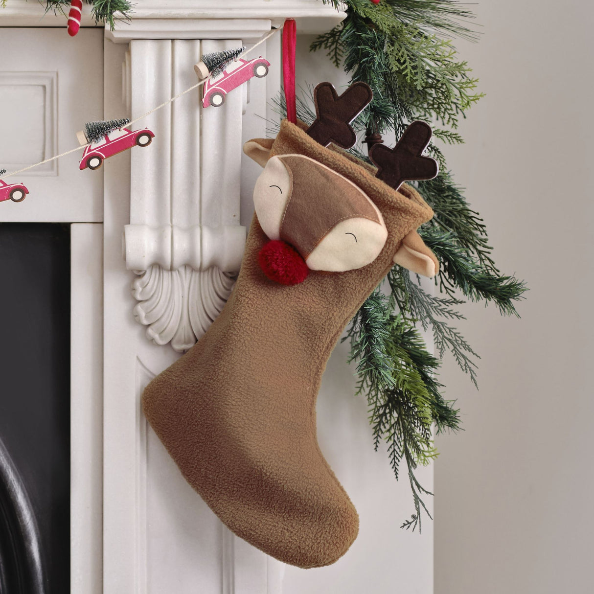 Eco-friendly Merry Little Reindeer Christmas Stocking with playful red pom pom nose, perfect for family traditions and holiday cheer.
