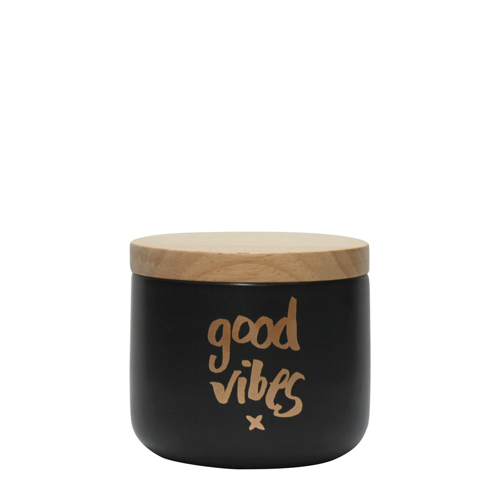 "Stylish 'Good Vibes' black matte canister with hand-lettered design and airtight wooden lid for chic storage solutions."