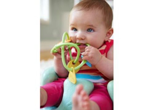 Eco-friendly Green Toys Twist Teether with vibrant charms and textures for safe sensory exploration in infants.