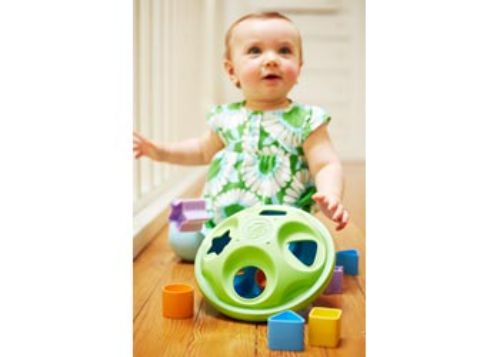 Eco-friendly Green Toys Shape Sorter featuring 8 vibrant shapes for developing motor skills and color recognition.