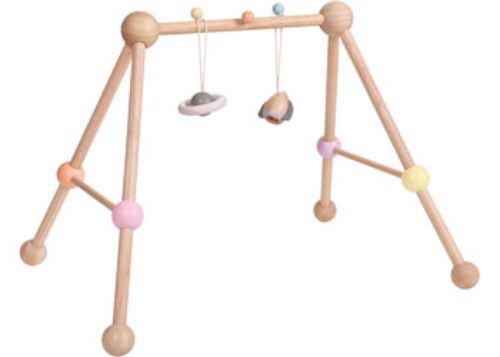 Pastel-colored PlanToys Play Gym with detachable toys, designed for infant motor skills and safe exploration.