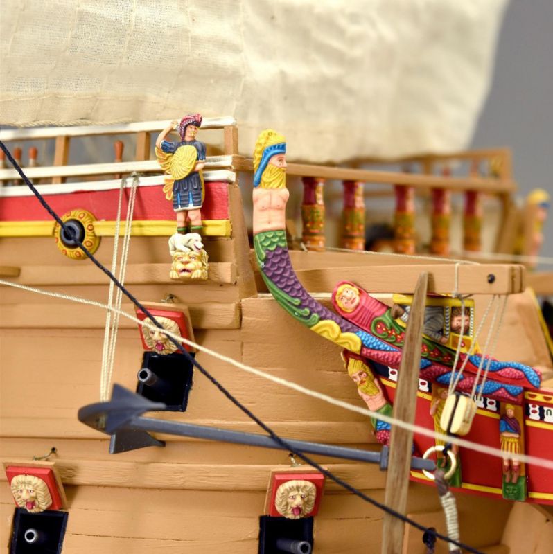 Detailed wooden model of the Swedish warship Vasa, showcasing intricate craftsmanship and historical elegance.