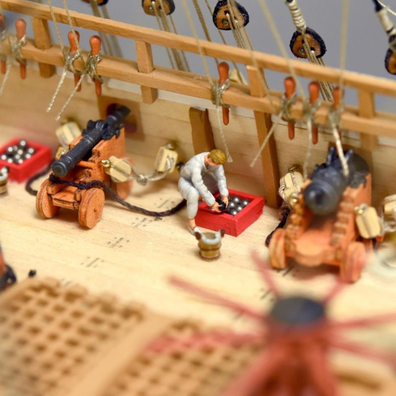 Detailed 1/65 scale wooden model of the Swedish warship Vasa, showcasing intricate craftsmanship and historical significance.