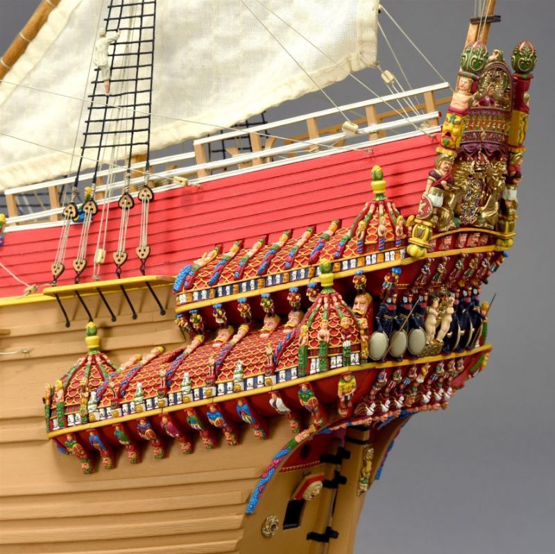 Detailed wooden model of the Swedish warship Vasa, showcasing intricate designs and historical elements from 1628.
