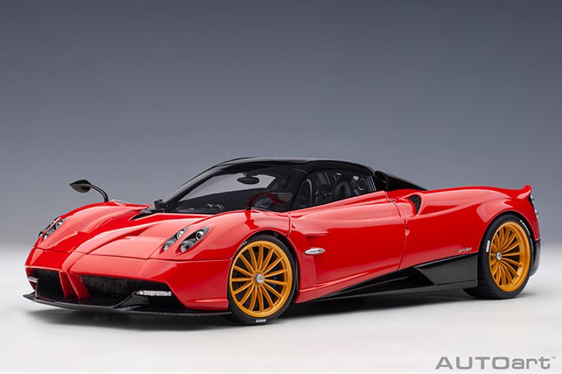 Detailed 1/18 scale AUTOart diecast model of Pagani Huayra Roadster in Rosso Monza Red, featuring opening doors and realistic design.